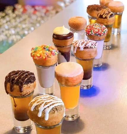 Donut Distillery mini donuts served on shot glasses at the bar
